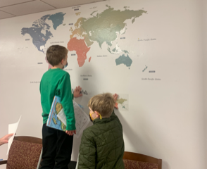 children studying a map